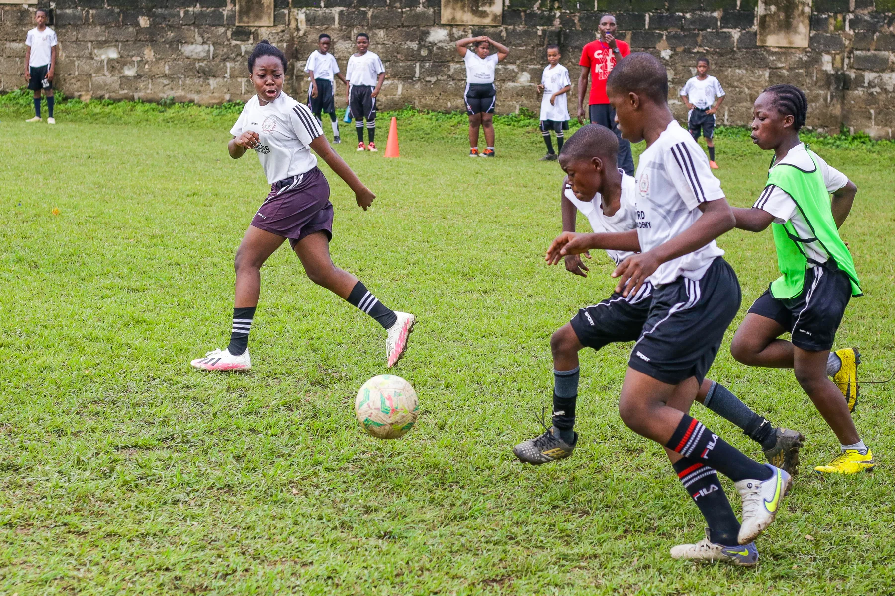 Academy players contesting the ball during a training game