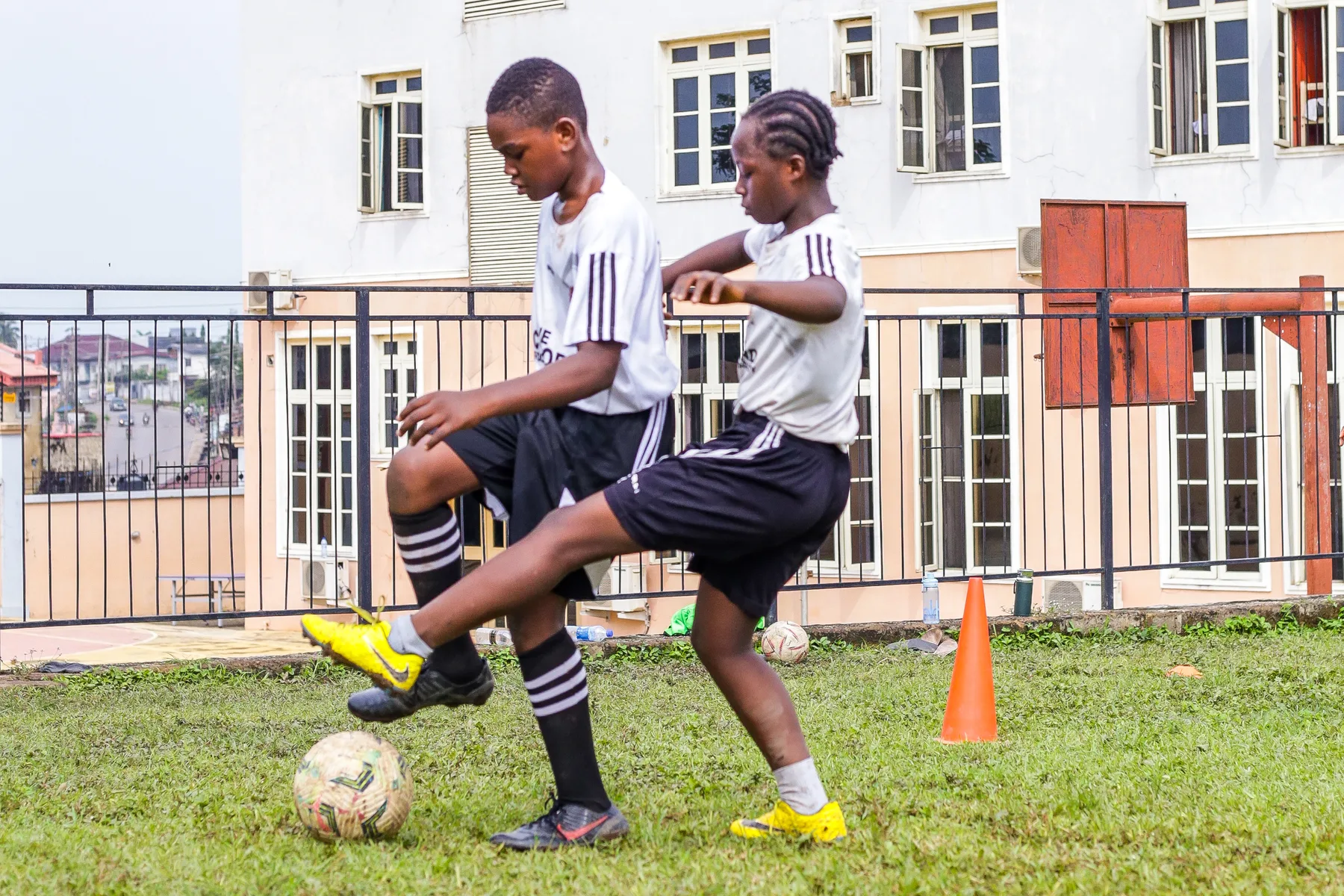 Two Concord Football Academy players practising close control